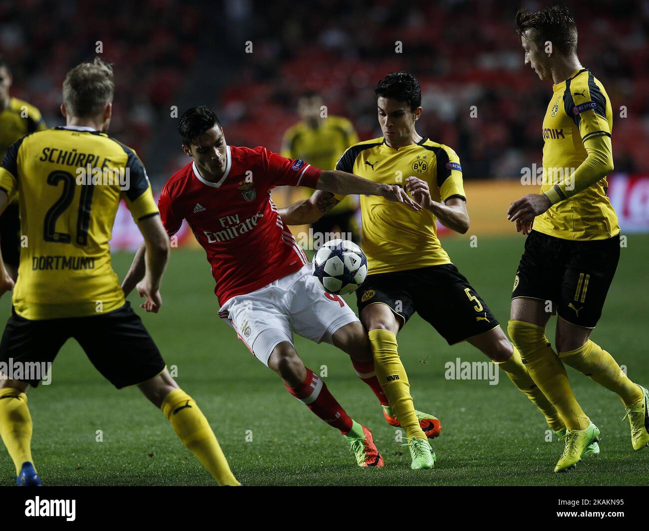 Benfica's forward Raul Jimenez (2nd L) vies for the ball with Dortmund's defender Marc Bartra (2nd R) during Champions League 2016/17 match between SL Benfica vs BVB Borussia Dortmund, in Lisbon, on February 14, 2017. (Photo by Carlos Palma/NurPhoto) *** Please Use Credit from Credit Field *** Stock Photo