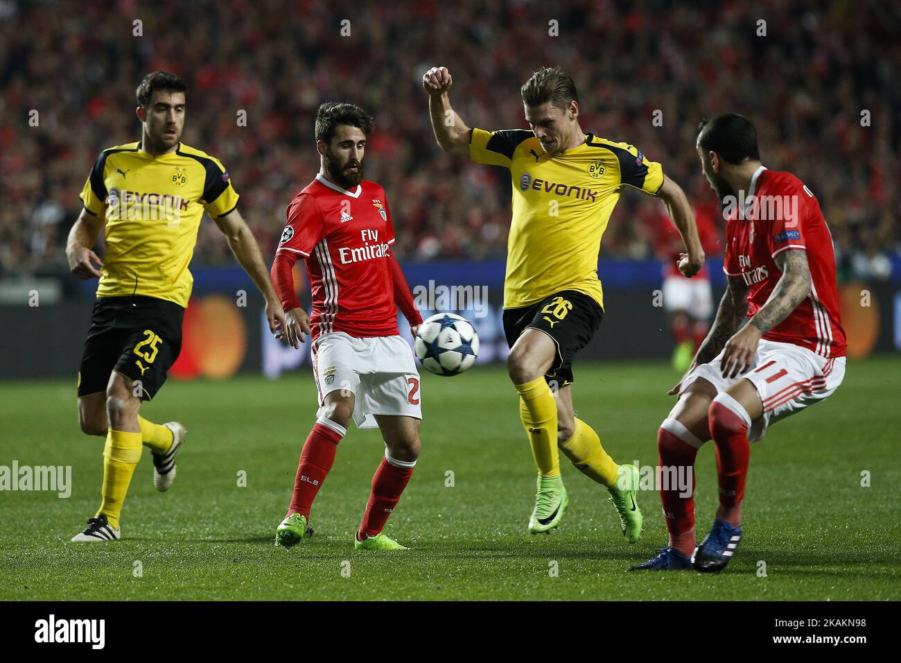 Benfica's midfielder Rafa Silva (2nd L) vies for the ball with Dortmund's defender Sokratis Papastathopoulos (L) and Dortmund's defender Lukasz Piszczek (2nd R) during Champions League 2016/17 match between SL Benfica vs BVB Borussia Dortmund, in Lisbon, on February 14, 2017. (Photo by Carlos Palma/NurPhoto) *** Please Use Credit from Credit Field *** Stock Photo