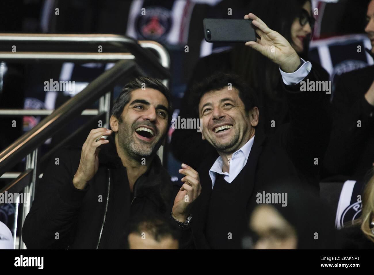 French comedian Ary Abittan (L) and French singer Patrick Bruel (R) attend the UEFA Champions League round of 16 first leg football match between Paris Saint-Germain and FC Barcelona on February 14, 2017 at the Parc des Princes stadium in Paris. (Photo by Geoffroy Van der Hasselt/NurPhoto) *** Please Use Credit from Credit Field *** Stock Photo
