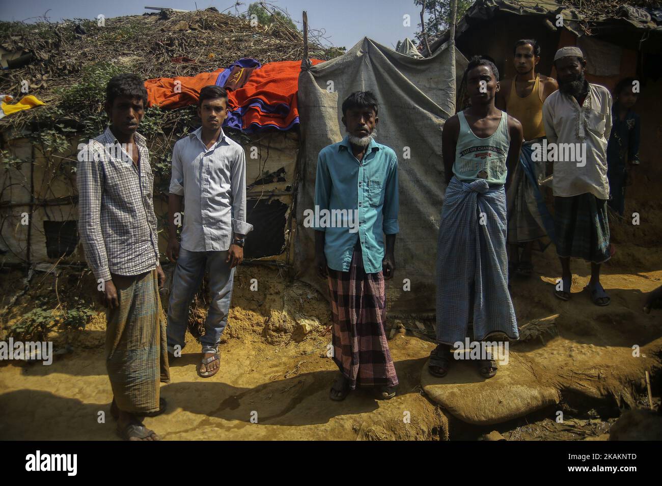 Minorit Ethnic of minority of Rohingya community stand outside their makeshift ...