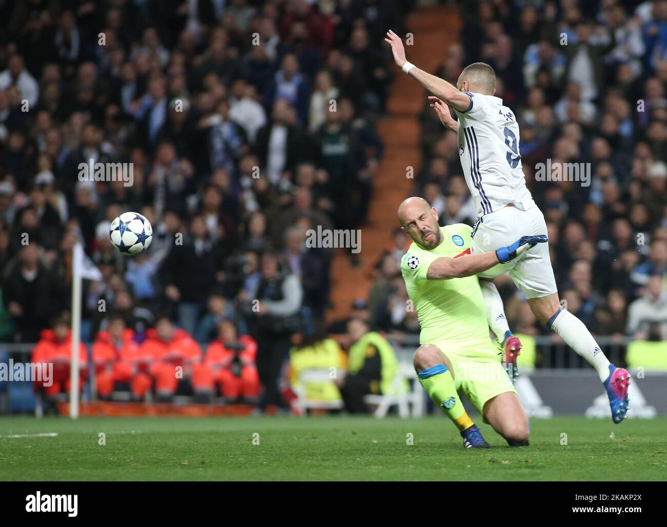 Real Madrid's French forward Karim Benzema (R) dives over Napoli's goalkeeper from Spain Pepe Reina during the UEFA Champions League round of 16 first leg football match Real Madrid CF vs SSC Napoli at the Santiago Bernabeu stadium in Madrid on February 15, 2017. (Photo by Raddad Jebarah/NurPhoto) *** Please Use Credit from Credit Field *** Stock Photo