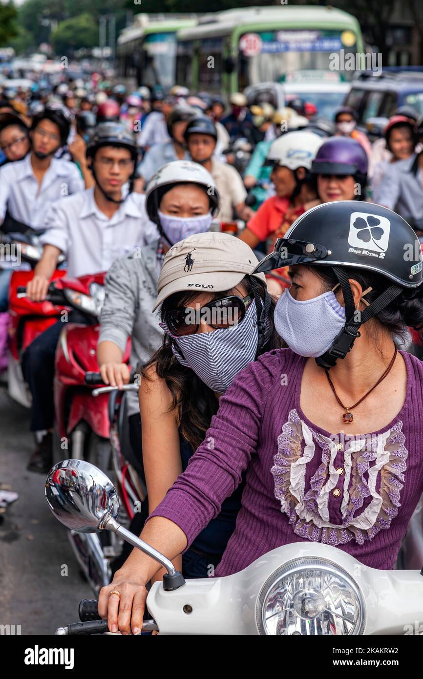Motorcycle riders, traffic, and congestion, Ho Chi Minh City centre, Vietnam Stock Photo
