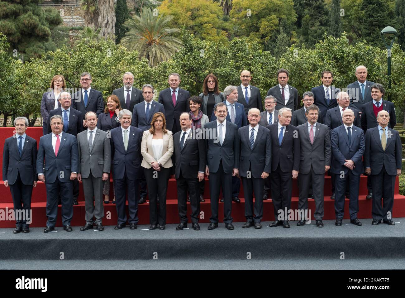 (Front row) Spanish Prime Minister Mariano Rajoy (CR) and President of the French Republic Francois Hollande (CL) pose for a family photo flanked by President of Andalusian regional government Susana Diaz (5L), Mayor of Malaga Francisco de la Torre (5R) , Spanish Interior Minister Juan Ignacio Zoido (2L), French Justice Minister Jean-Jacques Urvoas (3L), Spanish Minister of Foreign Affairs Alfonso Maria Dastis (4L), French Foreign Minister Jean-Marc Ayrault (4R), Spanish Minister of Justice Rafael Catala (3R), le French Interior Minister Bruno Le Roux (2R), (middle row) Spanish Minister of Eco Stock Photo