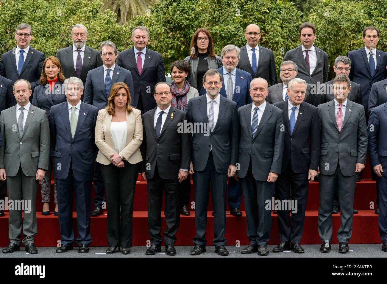 (Front row) Spanish Prime Minister Mariano Rajoy (4R) and President of the French Republic Francois Hollande (4L) pose for a family photo flanked by President of Andalusian regional government Susana Diaz (3L), Mayor of Malaga Francisco de la Torre (3R), French Justice Minister Jean-Jacques Urvoas (L), Spanish Minister of Foreign Affairs Alfonso Maria Dastis (2L), French Foreign Minister Jean-Marc Ayrault (2R), Spanish Minister of Justice Rafael Catala (R), (middle row) Spanish Minister of Economic Affairs and Competitiveness Luis de Guindos (L), French Minister for Ecology, Sustainable Develo Stock Photo