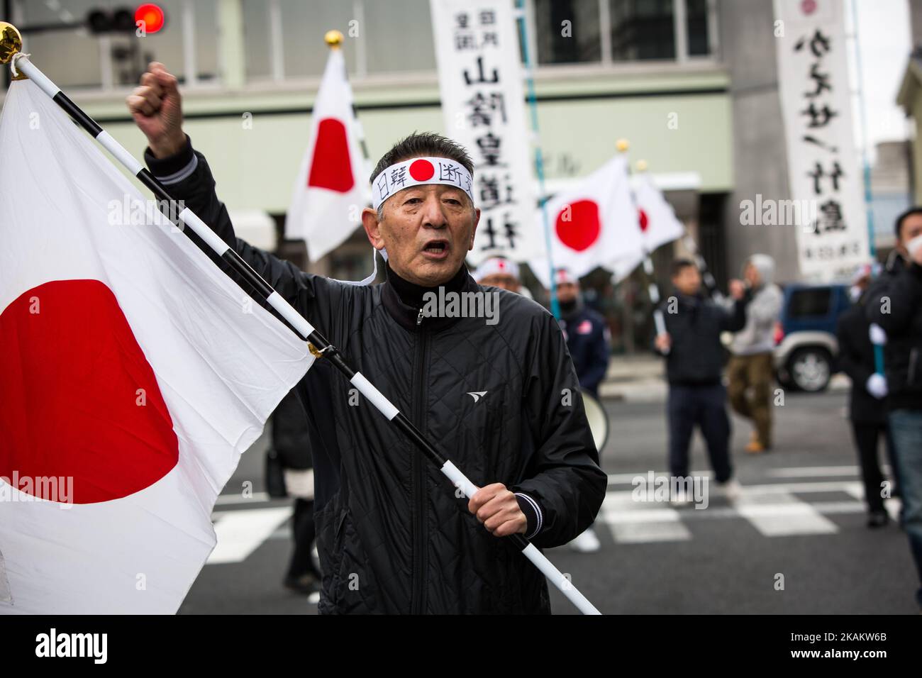 Japanese nationalists march with banners and flags to protest South Korea to return disputed islets prior to the ceremony of Takeshima Day, a small disputed island controlled by South Korea which it calls Dokdo and Japan calls Takeshima, in Matsue in Shimane Prefecture, western Japan on Feb. 22, 2017. Japan urged South Korea to return disputed islets, The sovereignty issue over the islands has been the subject of a long territorial dispute between South Korean and Japan. (Photo by Richard Atrero de Guzman/NurPhoto) *** Please Use Credit from Credit Field *** Stock Photo