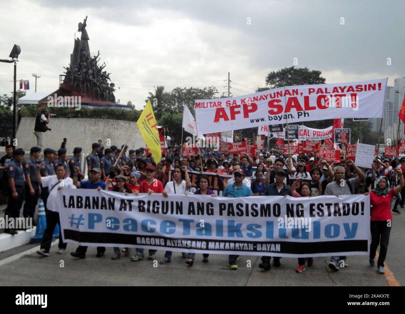 Protesters march towards Camp Aguinaldo during a protest on the 31st anniversary of the People Power Revolution on Saturday, February 25, 2017 in Quezon City, east of Manila, Philippines. The protesters called for the resumption of peace talks between the Philippine government and communist rebels. (Photo by Richard James Mendoza/NurPhoto) *** Please Use Credit from Credit Field *** Stock Photo