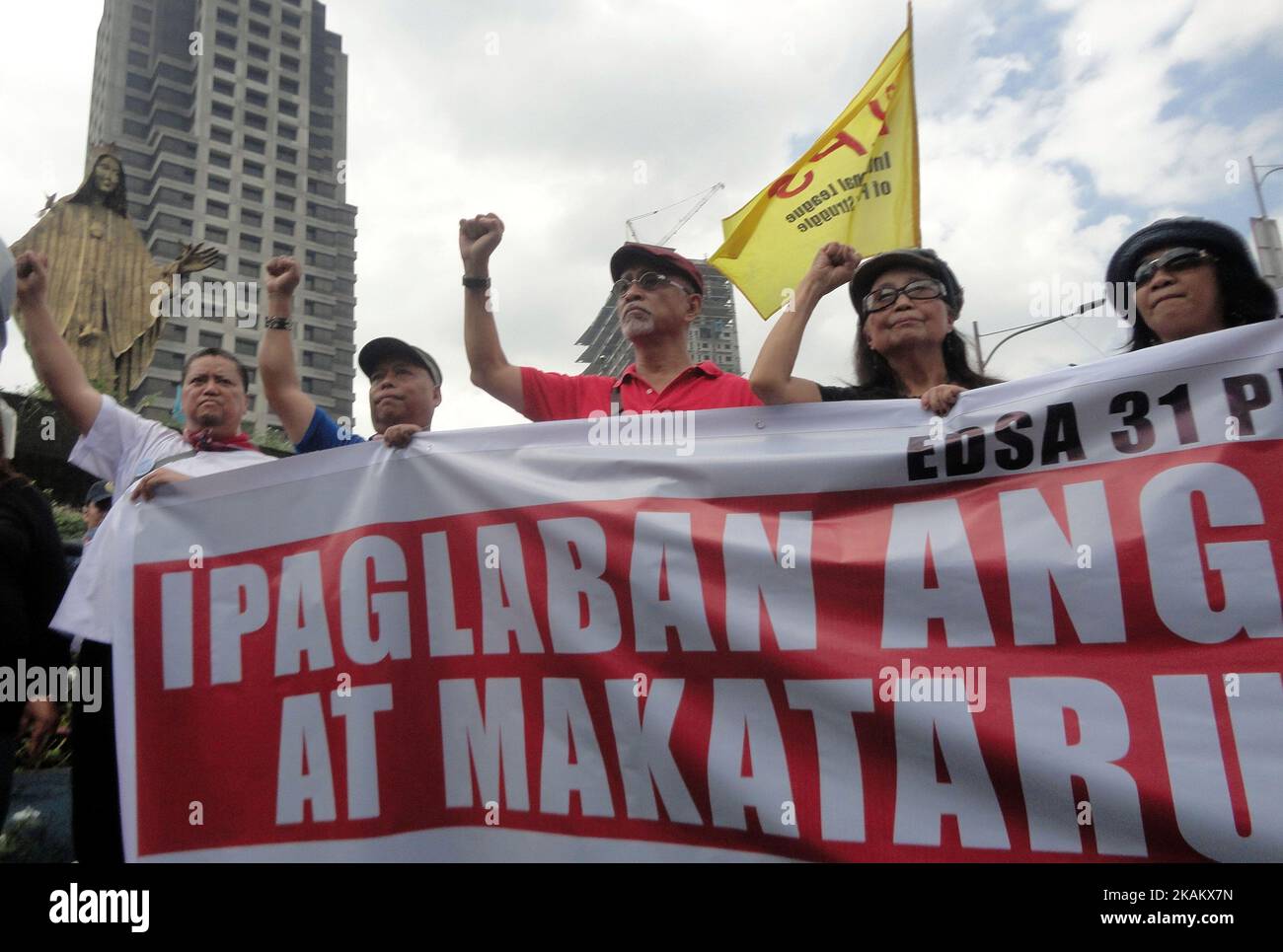 Protesters arrive outside EDSA Shrine in Quezon City, east of Manila, Philippines on the 31st anniversary of the People Power Revolution on Saturday, February 25, 2017. The protesters called for the resumption of peace talks between the Philippine government and communist rebels. (Photo by Richard James Mendoza/NurPhoto) *** Please Use Credit from Credit Field *** Stock Photo
