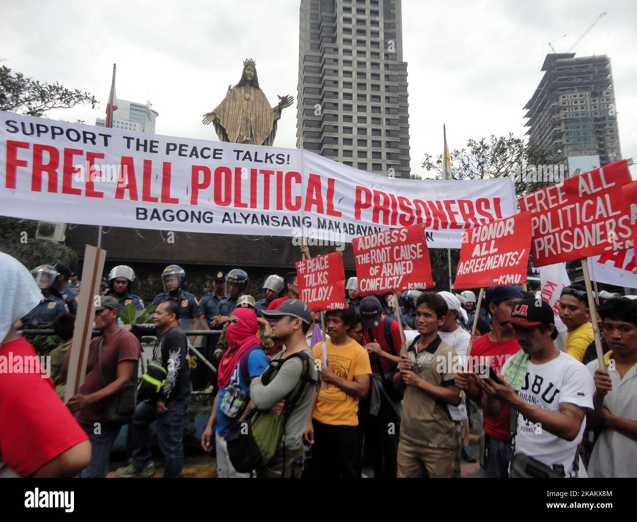 Protesters hold placards during a protest outside EDSA Shrine in Quezon City, east of Manila, Philippines on the 31st anniversary of the People Power Revolution on Saturday, February 25, 2017. The protesters called for the resumption of peace talks between the Philippine government and communist rebels. (Photo by Richard James Mendoza/NurPhoto) *** Please Use Credit from Credit Field *** Stock Photo