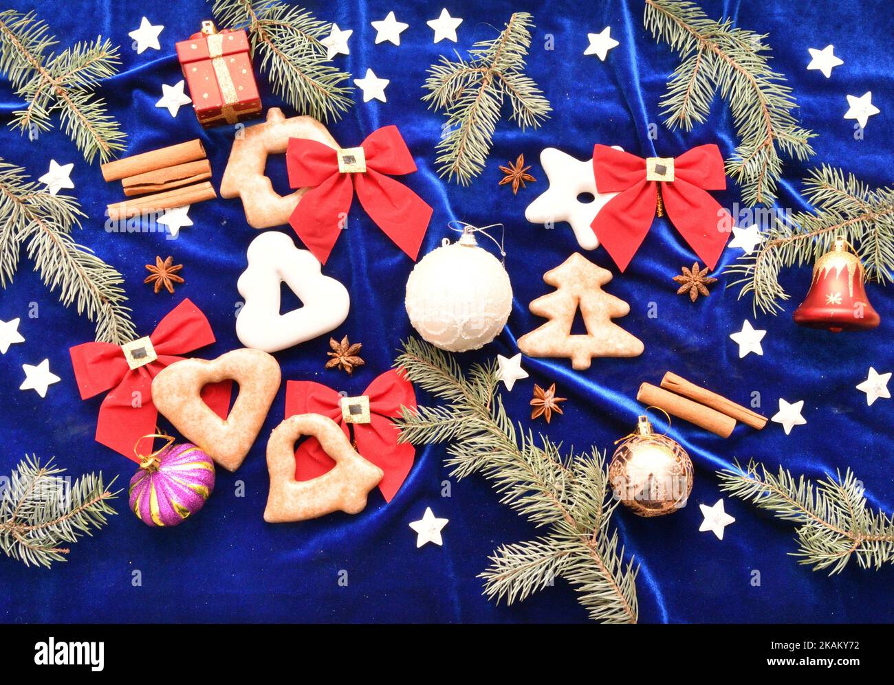 Christmas gingerbread, branches of blue spruce and Christmas decorations Stock Photo