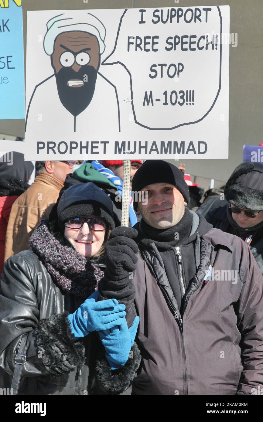 A group of Canadians gathered to protest against Islam, Muslims, Sharia Law and M-103 (private members motion put forth by Liberal MP Iqra Khalid to condemn Islamophobia) in downtown Toronto, Ontario, Canada, on March 04, 2017. Canadians across the country staged similar protests, which were met by counter protests by those supporting Muslims and in favour of M-103. M-103 is a private members motion put forth by Liberal MP Iqra Khalid that asks the government to 'recognize the need to quell the increasing public climate of hate and fear' and condemn Islamophobia, as well as all other kinds of  Stock Photo