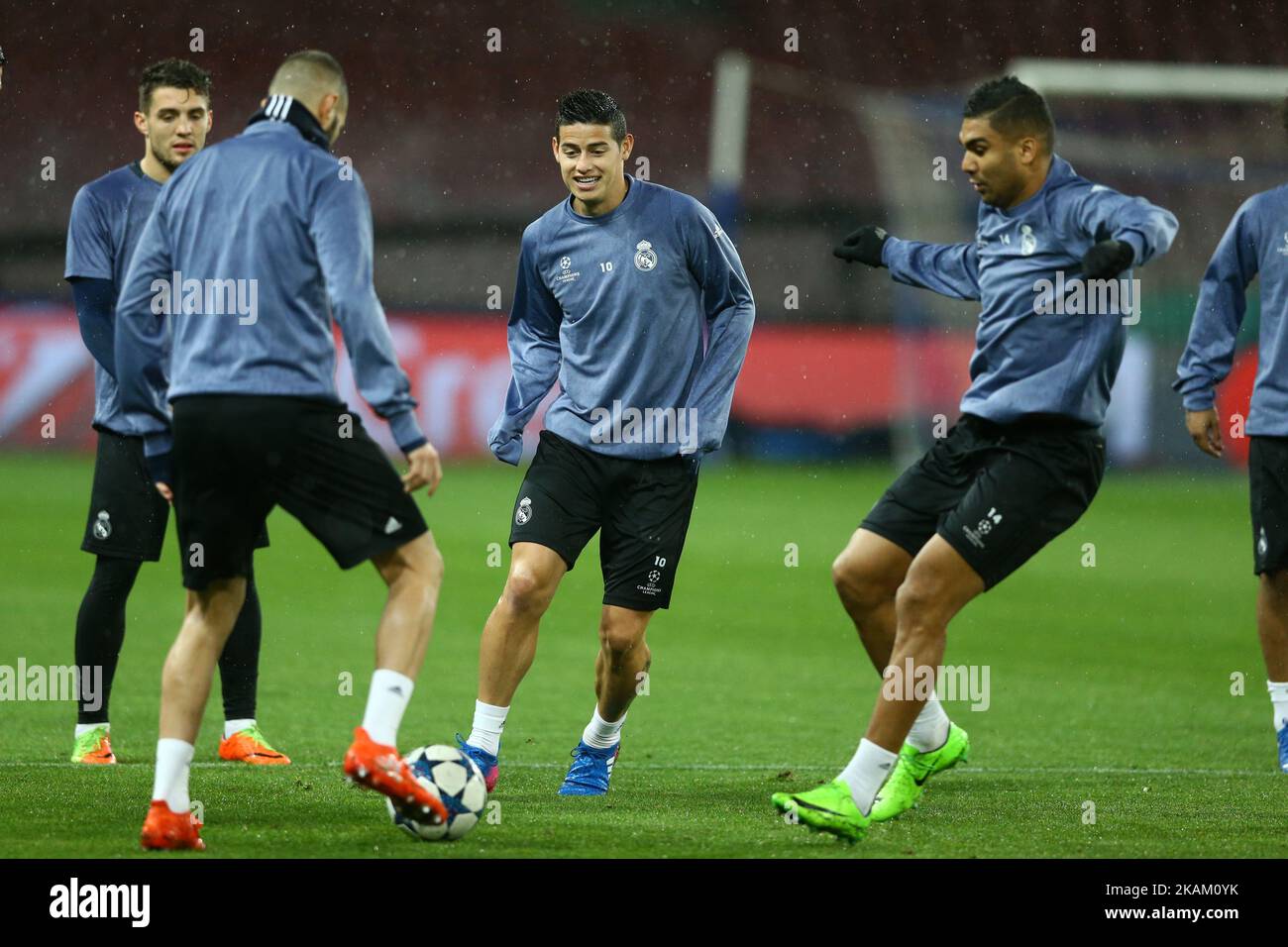 Real Madrid's players James Rodriguez and Casimiro attend a training session under heavy rain on the eve of the Champions League football match Napoli vs Real Madrid on March 6, 2017 at the San Paolo stadium in Naples. (Photo by Matteo Ciambelli/NurPhoto) *** Please Use Credit from Credit Field *** Stock Photo