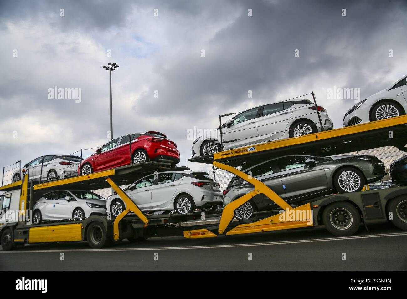 A brand new Opel Astra vehicles are transported by a car carrier trailer as they leave the Opel car factory of General Motors Manufacturing Poland in Gliwice, Poland, on March 7, 2017. General Motors is selling its loss-making European car business, including Germany's Opel and British brand Vauxhall, to France's PSA group. (Photo by Beata Zawrzel/NurPhoto) *** Please Use Credit from Credit Field *** Stock Photo