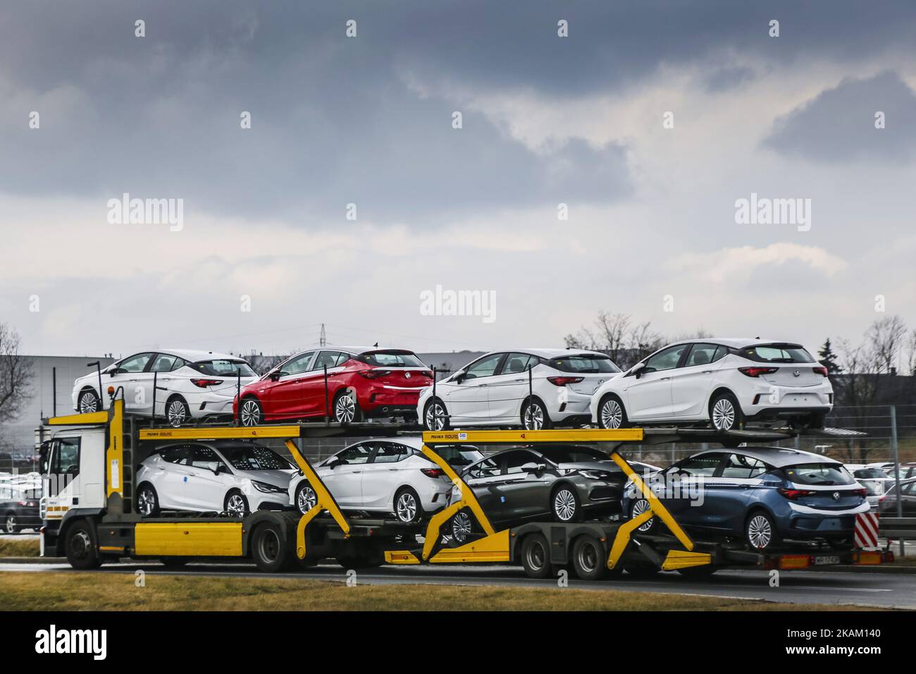 A brand new Opel Astra vehicles are transported by a car carrier trailer as they leave the Opel car factory of General Motors Manufacturing Poland in Gliwice, Poland, on March 7, 2017. General Motors is selling its loss-making European car business, including Germany's Opel and British brand Vauxhall, to France's PSA group. (Photo by Beata Zawrzel/NurPhoto) *** Please Use Credit from Credit Field *** Stock Photo