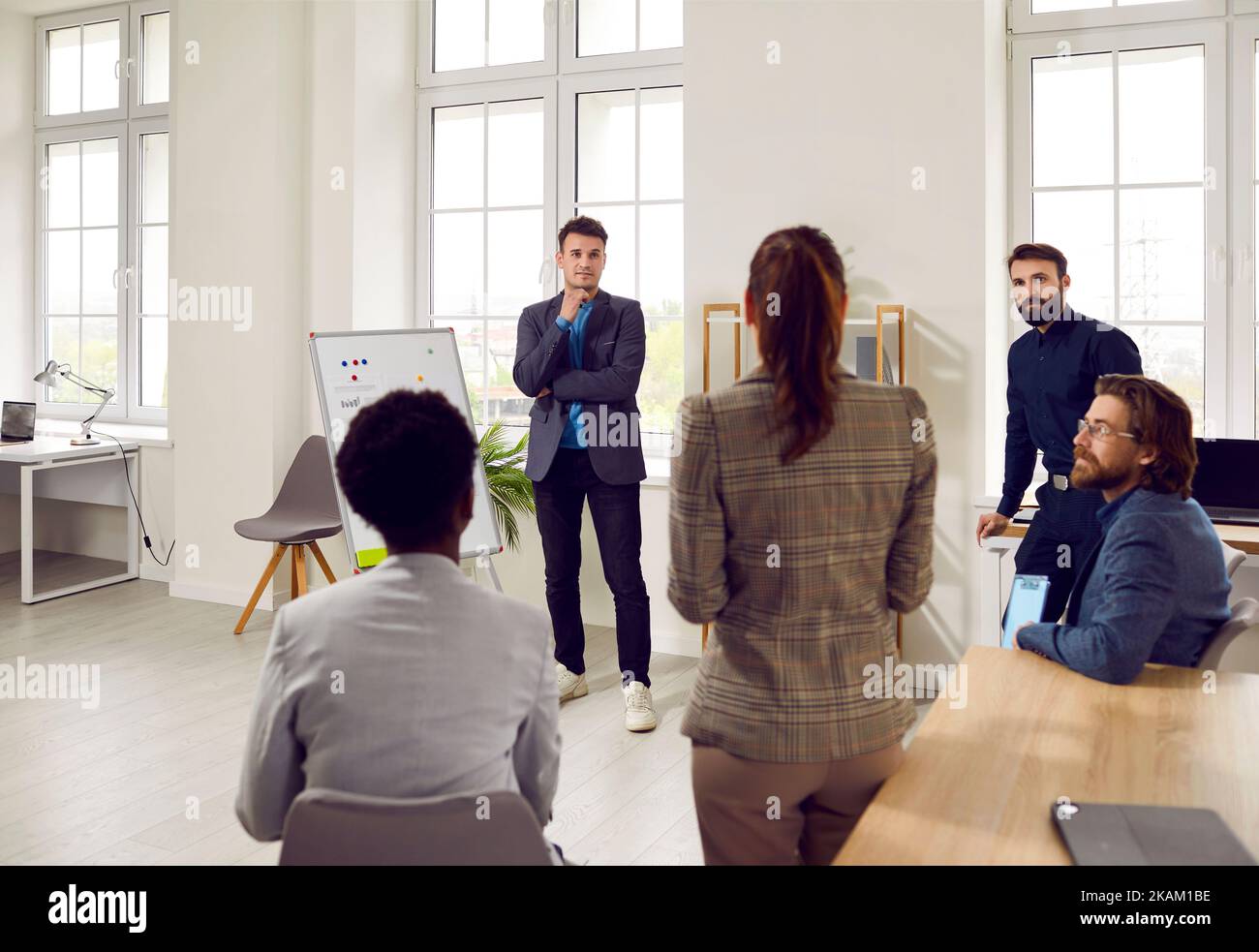 Young Professionals diverse people hold morning meeting with team startup in conference room Stock Photo