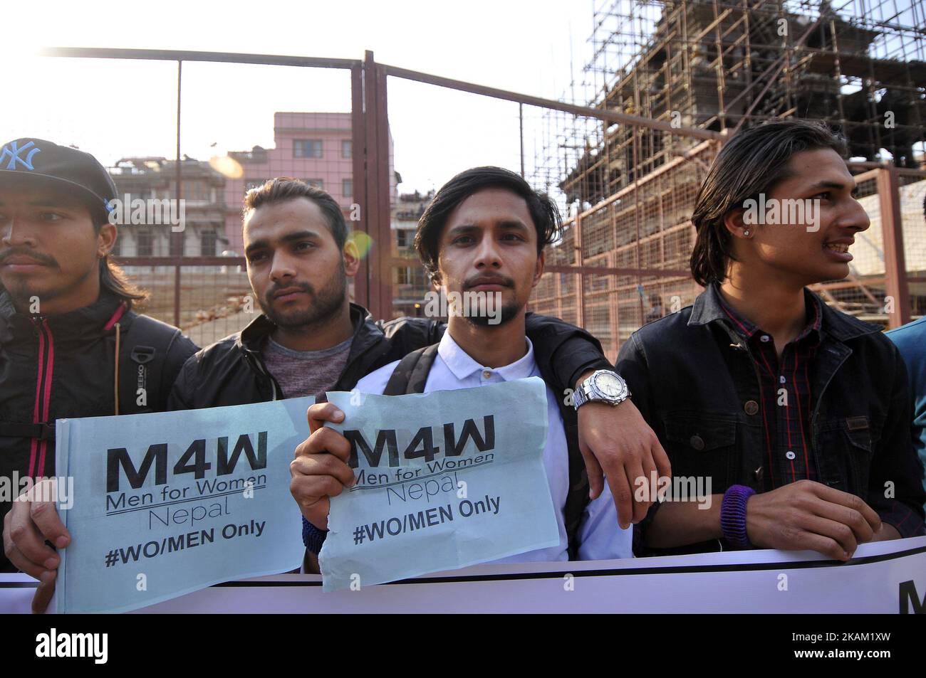 Nepalese youth rally on a prade with the slogan 'Men March for Woman' during 107th International Women's Day Celebrates in Patan, Nepal on Wednesday, March 08, 2017. (Photo by Narayan Maharjan/NurPhoto) *** Please Use Credit from Credit Field *** Stock Photo