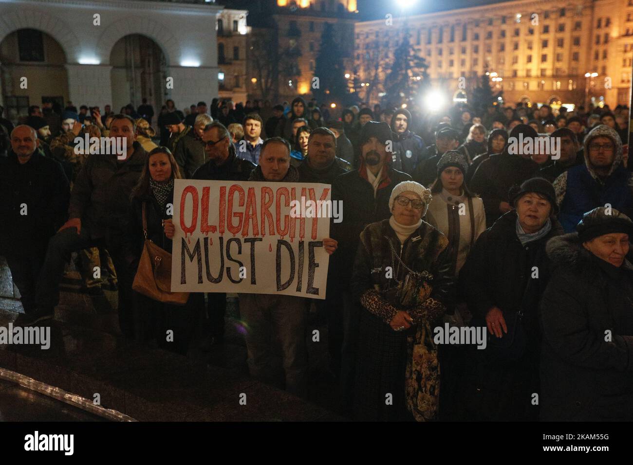 A man holds placard which says 'Oligarchy must die' during a rally downtown Kyiv, Ukraine, March 14, 2017. To mark Volunteer Fighter Day activists and supporters of Ukrainian radical nationalist groups demand the closure of all banks associated with Russia in Ukraine and demanded the stop of trade between Ukrainian businessmen with Russian-backed separatists in eastern Ukraine. (Photo by Sergii Kharchenko/NurPhoto) *** Please Use Credit from Credit Field *** Stock Photo