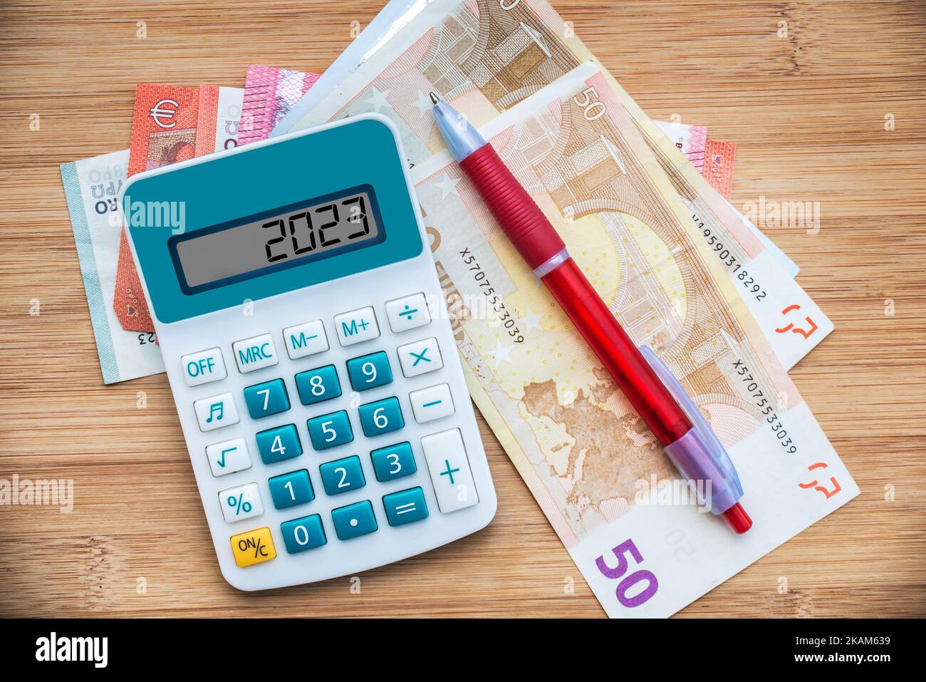2023 numbers on a calculator and euros banknotes, new year finance, money inflation and budget concept Stock Photo