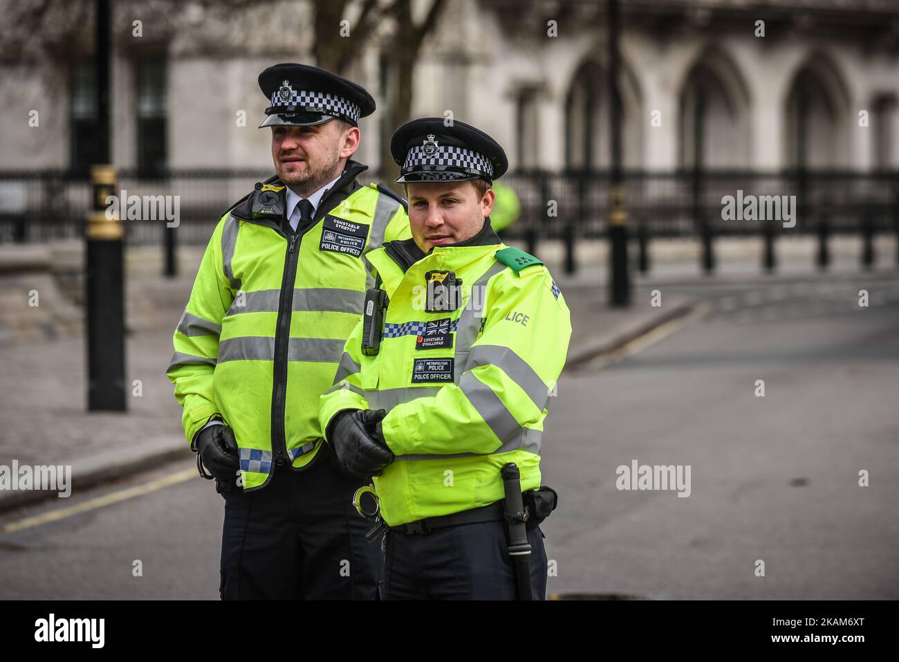 Police officers in London, on March 23, 2017. Police continue investigations after the terror attack in London yesterday in which a car was driven into pedestrians on Westminster Bridge and then into railings outside the Houses of Parliament, where a knifeman stabbed a police officer named as PC Keith Palmer, who subsequently died from his injuries. The attacker also died after security forces shot him. Two other people died in the incident and approx 40 were injured, some 'catastrophically'. A woman was pulled alive from the Thames after reportedly jumping off the bridge to escape the attack. Stock Photo