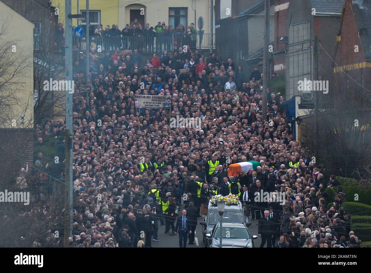 The coffin of former Northern Ireland Deputy First Minister Martin McGuinness is taken away from his house just ahead of the procession in the Bogside neighbourhood of Derry on its way to St. Columba's Church Longtower. On Thursday, March 23, 2017, in Londonderry, Northern Ireland. Photo by Artur Widak *** Please Use Credit from Credit Field ***  Stock Photo