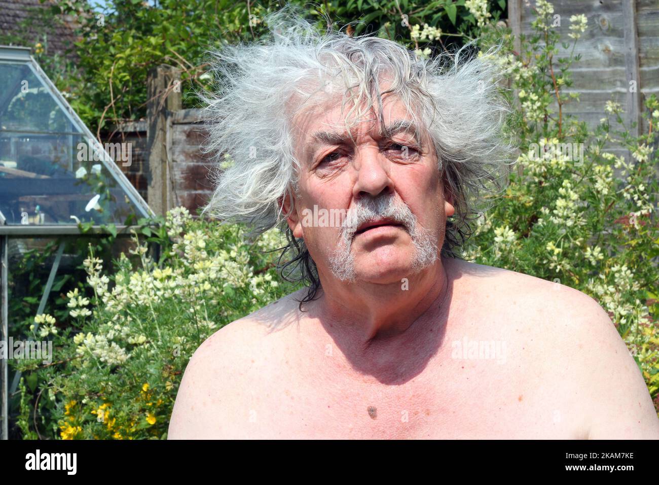 Bad hair day. Senior man with very untidy hair. Funny. Stock Photo