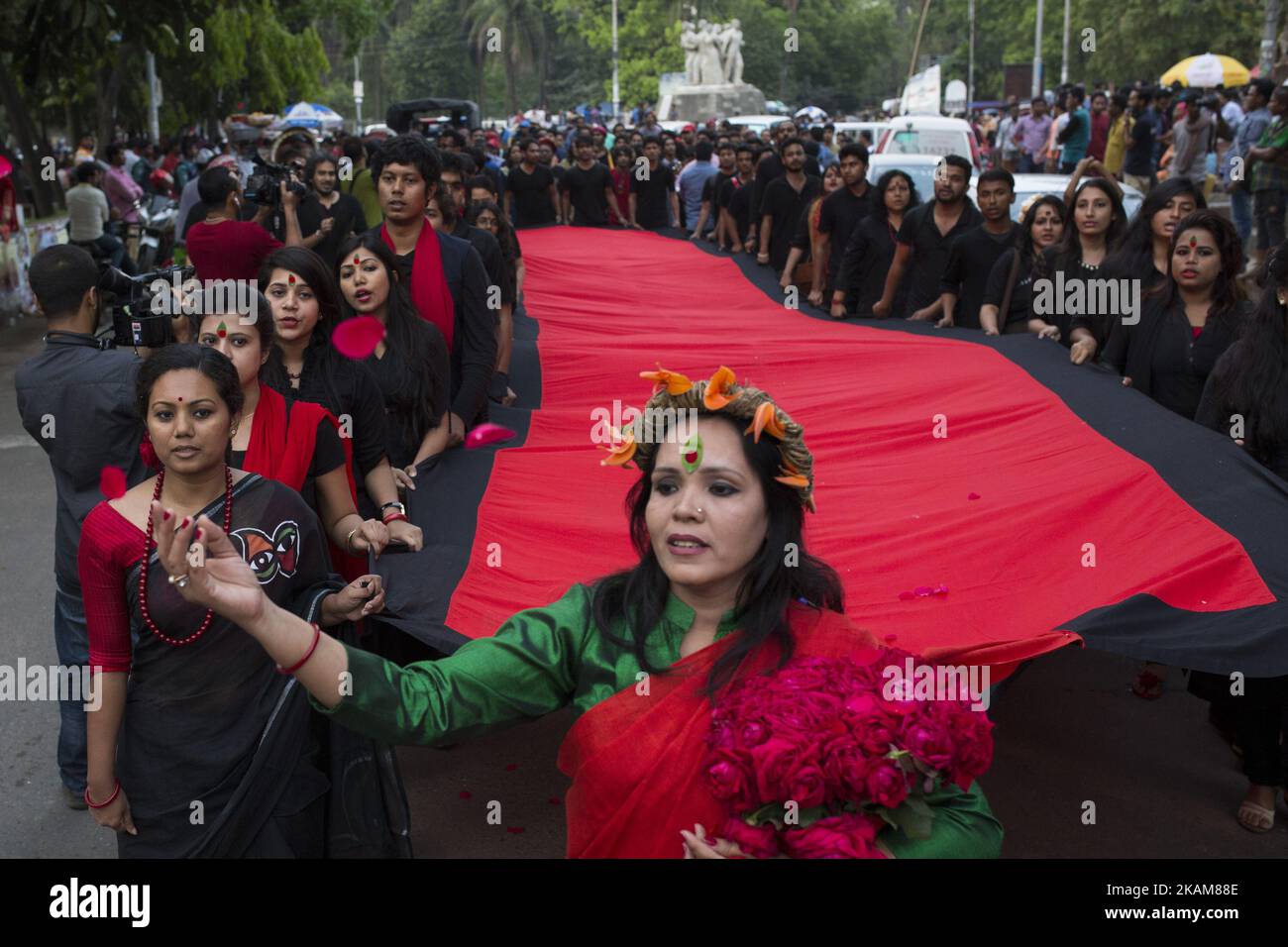 DHAKA, BANGLADESH - MARCH 25 : Prachyanat School of Acting and Design will take out a procession Lal Jatra, to observe the dark night of March 25, 1971 in Dhaka, Bangladesh on March 25, 2017. On this black night in the nationl history, the Pakistani military rulers launched ''Operation Searchlight'' killing some thousand people in that night crackdown alone. As part of the operation, tanks rolled out of Dhaka cantonment and a sleeping city woke up to the rattles of gunfire as the Pakistan army attacked the halls at Dhaka University, the then East Pakistan Rifles (now Border Guard Bangladesh)  Stock Photo