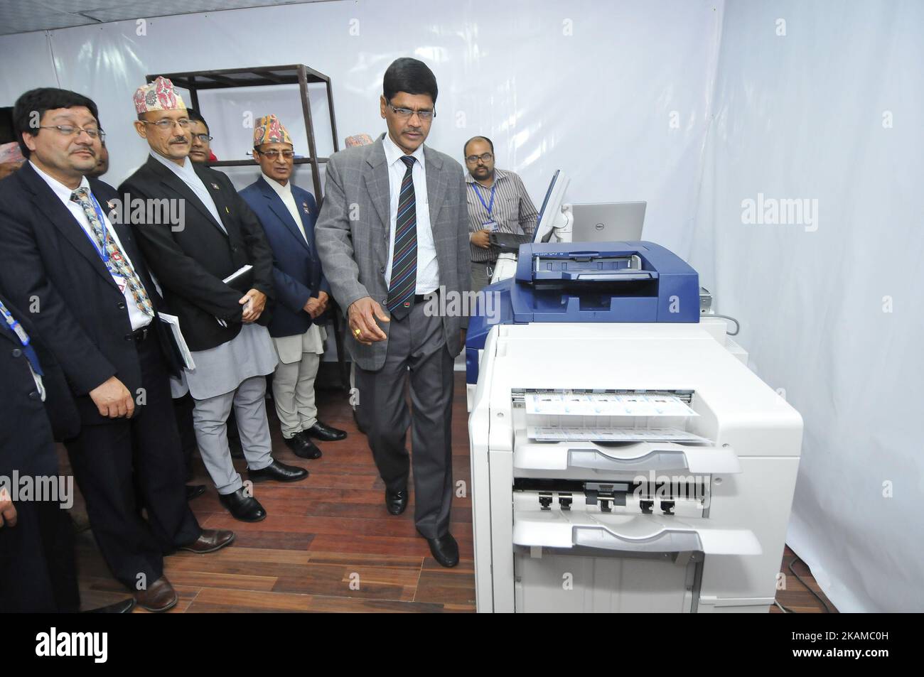 Chief Election Commissioner Dr. Ayodhi Prasad Yadav checks printing of the voters' identity cards at Election Commission Building, Kathmandu, Nepal on Monday, April 03, 2017. The Election Commission has started printing voters' identity cards for upcoming local level election scheduled on May 14, 2017. The Election Commission approved the name of 14.54 million voters for the local level election on Sunday, April 02, 2017. (Photo by Narayan Maharjan/NurPhoto) *** Please Use Credit from Credit Field *** Stock Photo