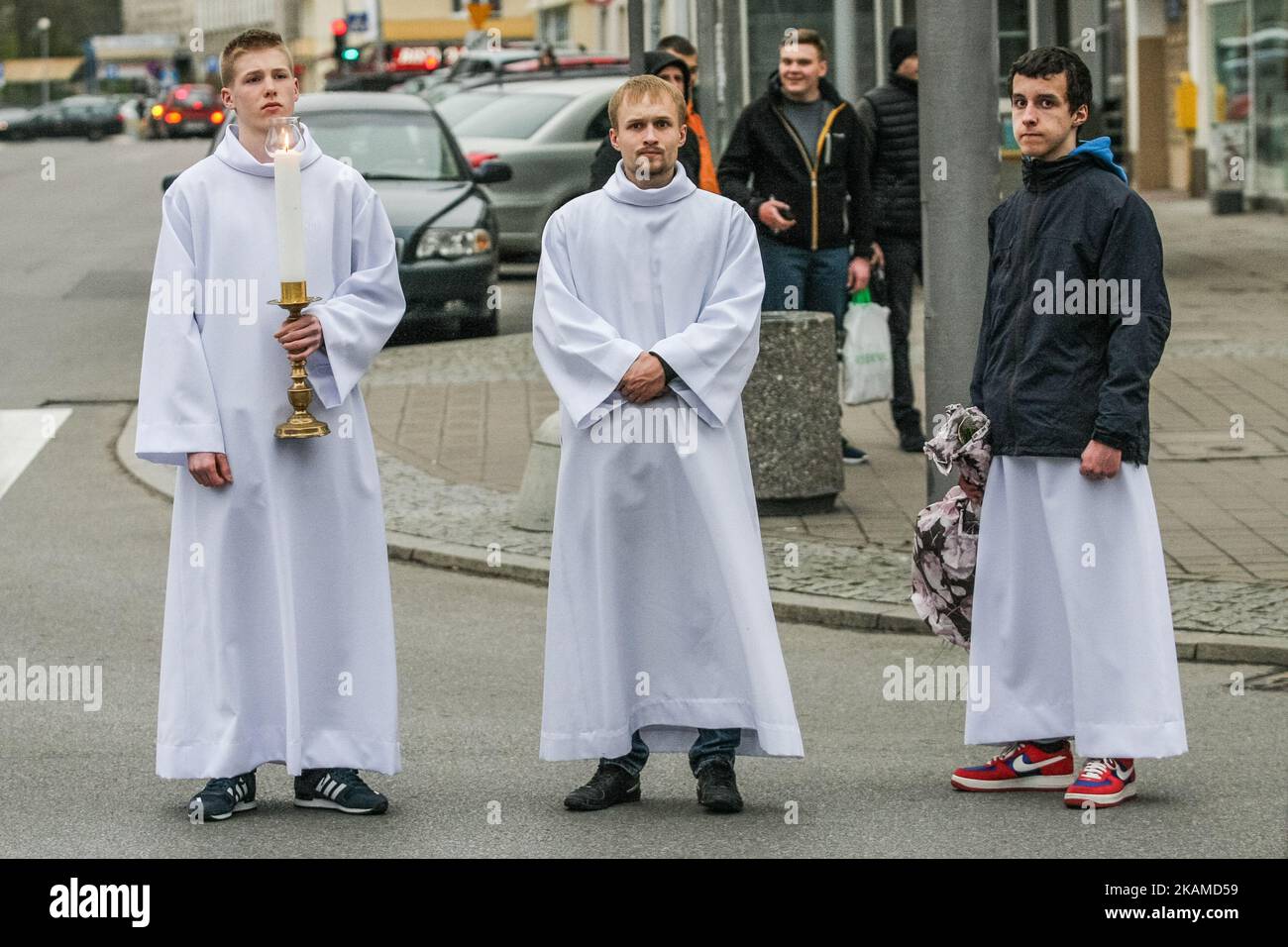 Acolytes attending the Way of the Cross procession are seen on 7 April 2017 in Gdynia, Poland. Way of the Cross also known as Way of Sorrows or Via Crucis processions are usually observed during Lent, especially on Lenten Fridays and most importantly on Good Friday. It is one of the most popular devotions for Roman Catholics. The devotion consists of meditating on 14 events which form the 14 stations of the cross. The purpose of this devotion is to focus on the Passion of Jesus Christ. (Photo by Michal Fludra/NurPhoto) *** Please Use Credit from Credit Field *** Stock Photo