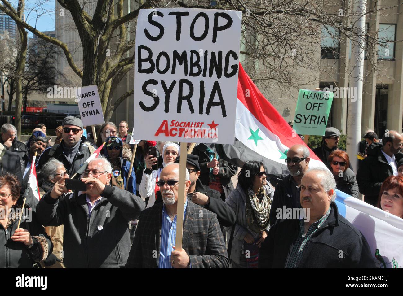 Protest against US President Donald Trump's decision to launch airstrikes against Syria on April 8, 2017 in Toronto, Ontario Canada. Protestors gathered to outside the American Consulate in Toronto to denounce this week's airstrikes against the Syrian regime. America launched a missile strike against Syria for the first time since the civil war began, targeting an airbase in the small town of Idlib from which the United States claims this week’s chemical weapons attack on civilians was launched by Bashar al-Assad’s regime. (Photo by Creative Touch Imaging Ltd./NurPhoto) *** Please Use Credit f Stock Photo