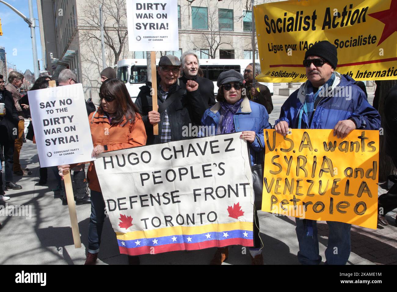 Venezuelans stand in solidarity with Syria during a protest against US President Donald Trump's decision to launch airstrikes against Syria on April 8, 2017 in Toronto, Ontario Canada. Protestors gathered to outside the American Consulate in Toronto to denounce this week's airstrikes against the Syrian regime. America launched a missile strike against Syria for the first time since the civil war began, targeting an airbase in the small town of Idlib from which the United States claims this week’s chemical weapons attack on civilians was launched by Bashar al-Assad’s regime. (Photo by Creative  Stock Photo