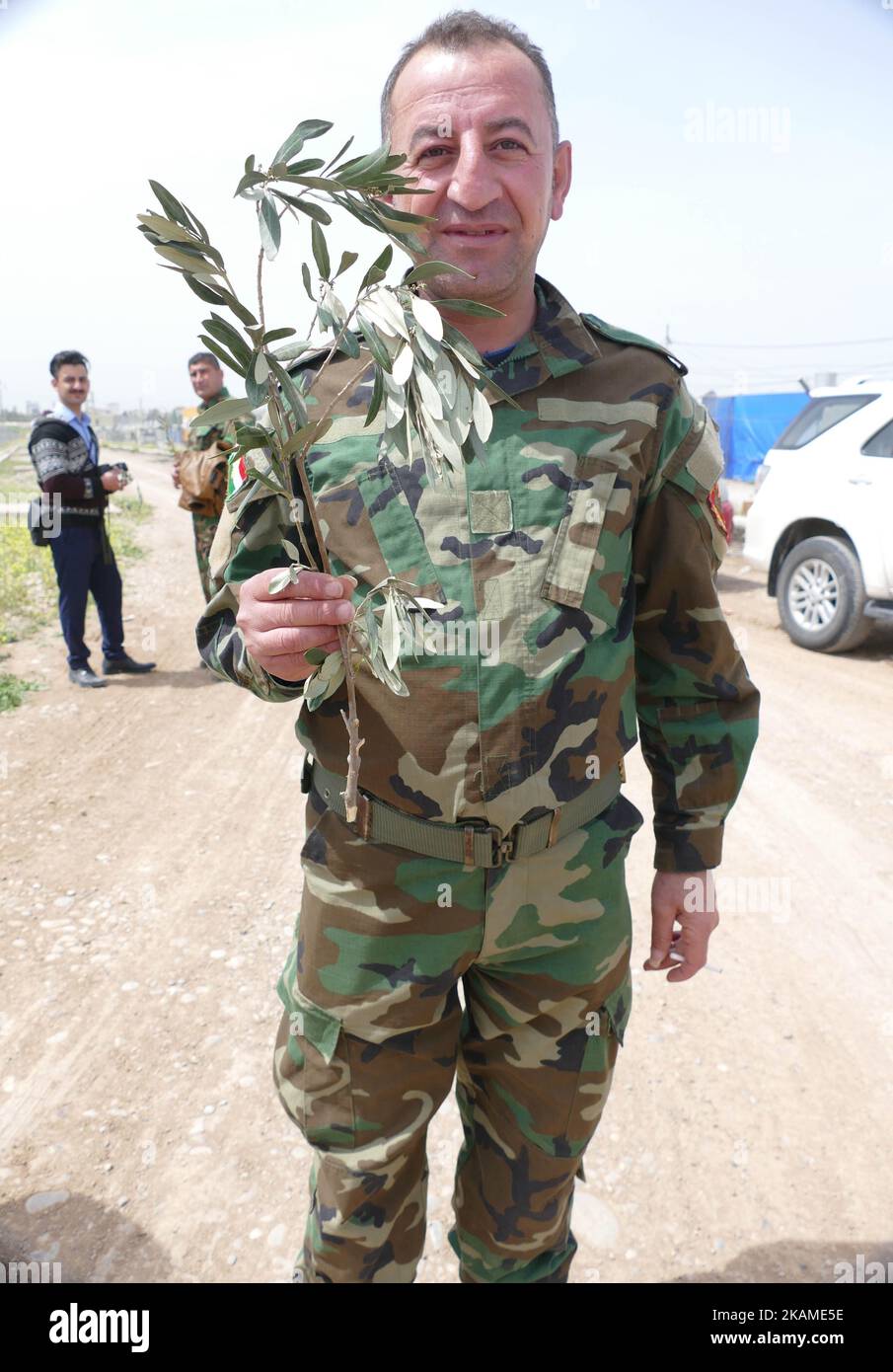 Peshmerga join a Peace Solidarity March on Palm Sunday with the Chaldean Christian church members to show their respect on Palm Sunday they also carried branches of the Olive tree- Erbil, Iraq (Photo by Gail Orenstein/NurPhoto) *** Please Use Credit from Credit Field *** Stock Photo