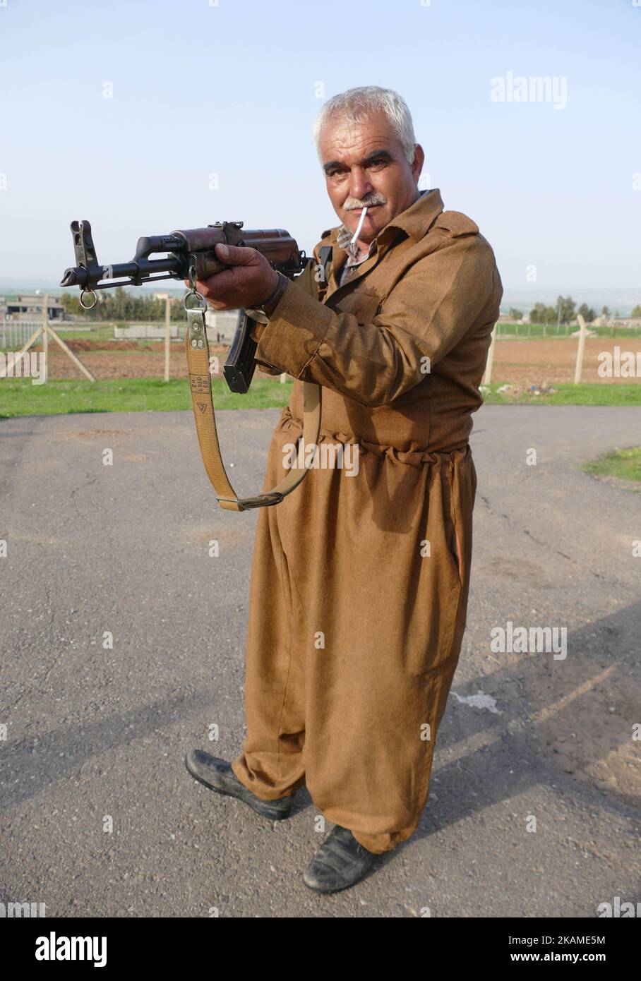 An Iranian Peshmerga watches Jazhnikan camp where the Iranain community in Erbil , Kurdistan, on 9 April 2017. The camp is heavily guarded with Iranian Kurdish Peshmerga. (Photo by Gail Orenstein/NurPhoto) *** Please Use Credit from Credit Field *** Stock Photo