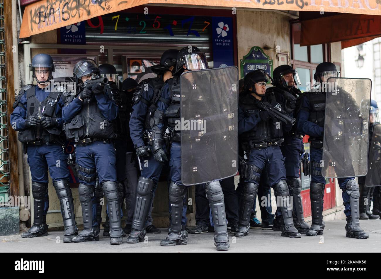 French anti-riot policemen stand guard the street during a demonstration for a 'social first round' of the French presidential election on April 22, 2017 on the place de la Republique in Paris. France was on edge on April 22 on the eve of its most unpredictable presidential election in decades, which will take place under heightened security after the jihadist killing of a policeman. (Photo by Julien Mattia/NurPhoto) *** Please Use Credit from Credit Field *** Stock Photo