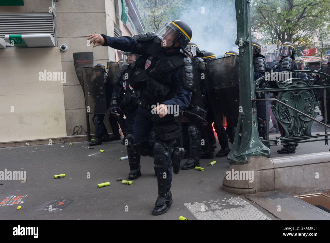 French anti-riot policemen stand guard the street during a demonstration for a 'social first round' of the French presidential election on April 22, 2017 on the place de la Republique in Paris. France was on edge on April 22 on the eve of its most unpredictable presidential election in decades, which will take place under heightened security after the jihadist killing of a policeman. (Photo by Julien Mattia/NurPhoto) *** Please Use Credit from Credit Field *** Stock Photo