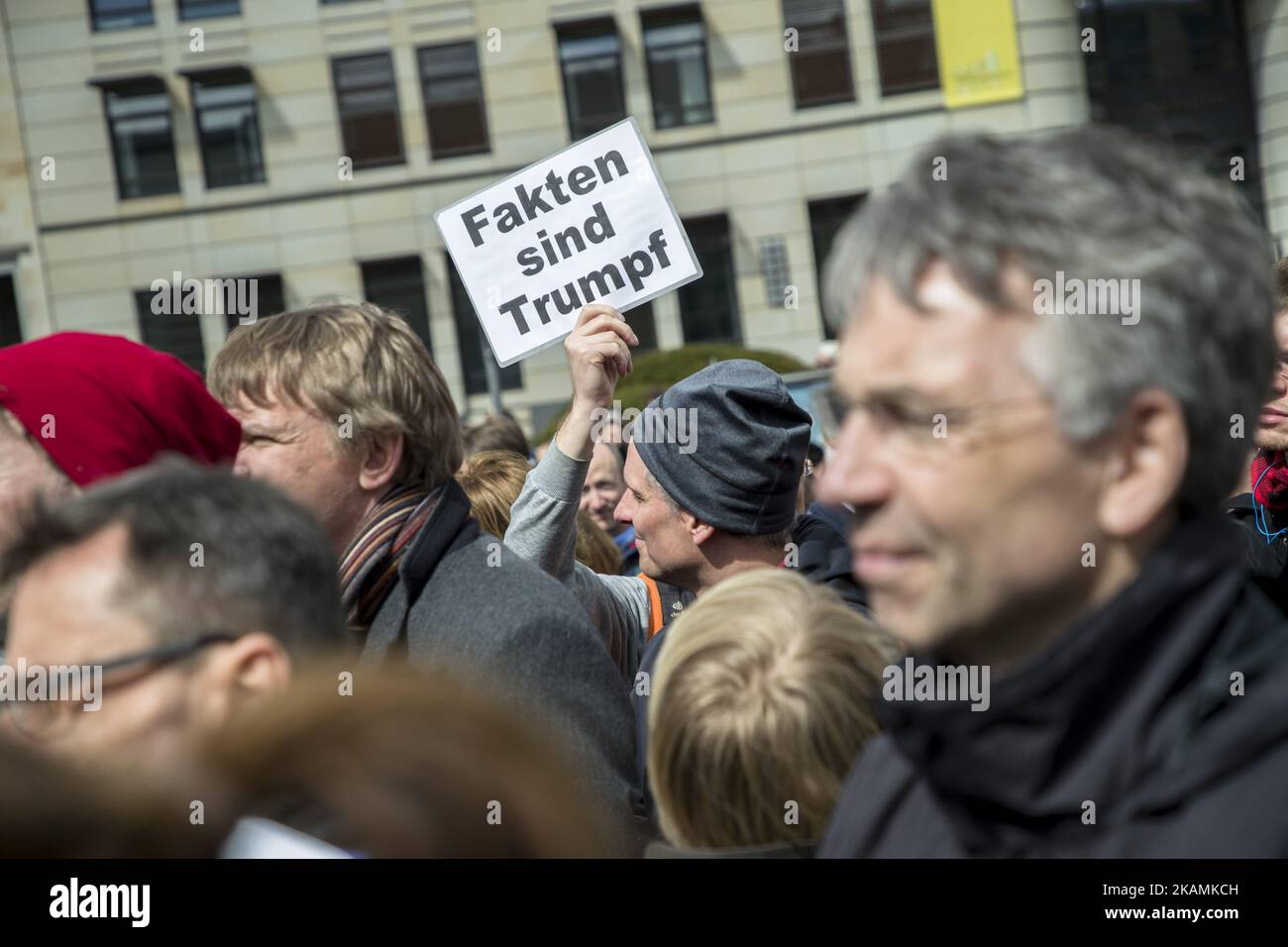 A man attending the 'March for Science' holds a banner reading 'facts are trump' in Berlin, Germany on April 22, 2017. Thousands of people rallied and rally today in more than 500 marches all over the world to remark the importance of science and the role of scientifically verifiable facts and results for freedom and democracy against the rise of 'alternative facts'. (Photo by Emmanuele Contini/NurPhoto) *** Please Use Credit from Credit Field *** Stock Photo