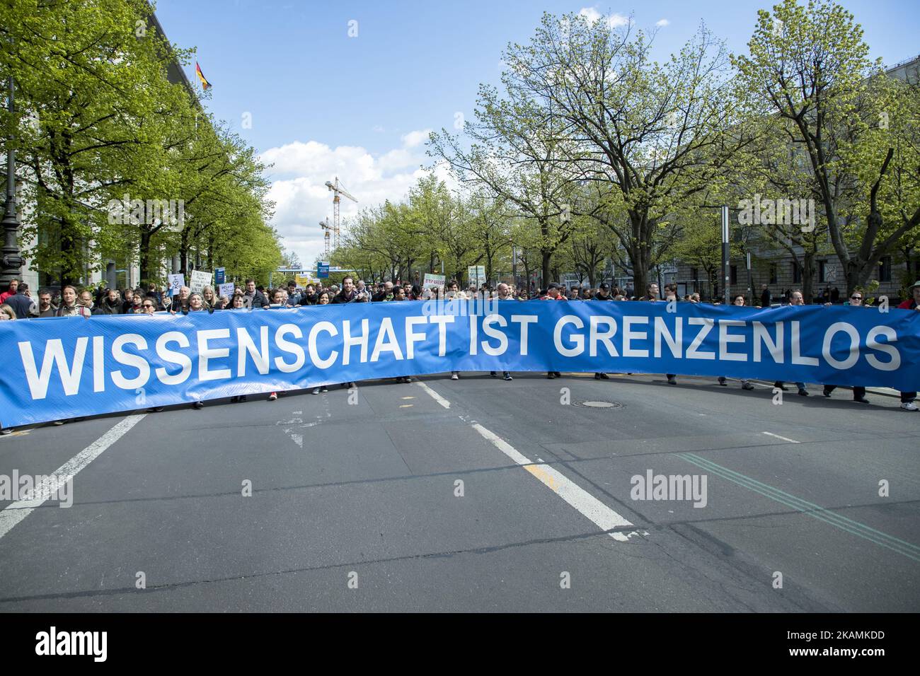 People attending the 'March for Science' hold a banner reading 'science is without borders' in Berlin, Germany on April 22, 2017. Thousands of people rallied and rally today in more than 500 marches all over the world to remark the importance of science and the role of scientifically verifiable facts and results for freedom and democracy against the rise of 'alternative facts'. (Photo by Emmanuele Contini/NurPhoto) *** Please Use Credit from Credit Field *** Stock Photo