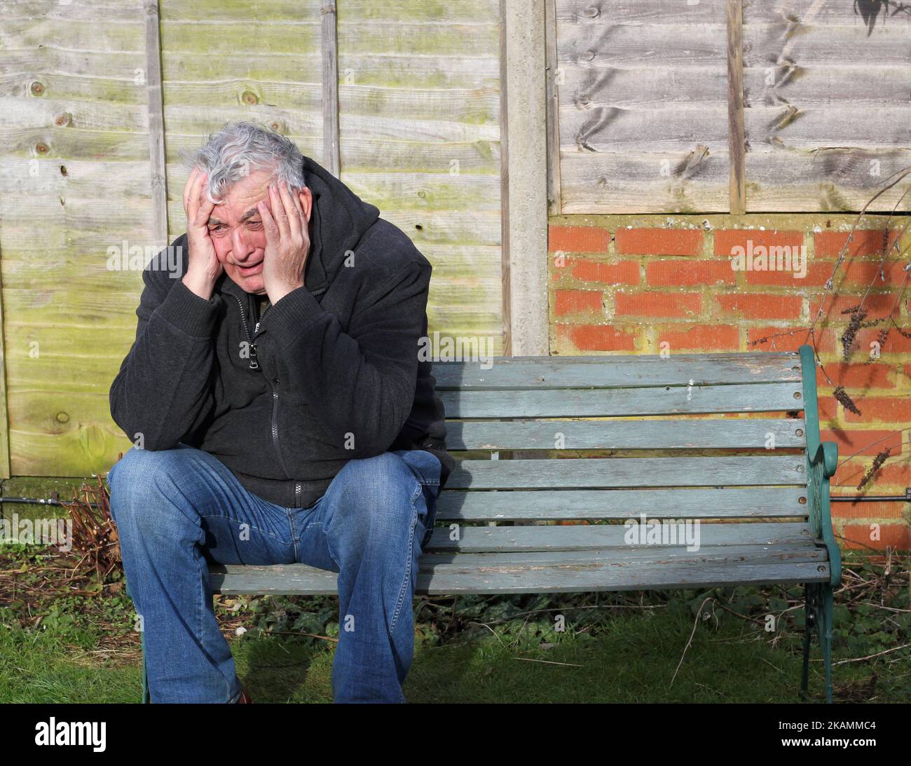 Anxiety. Old or elderly man suffering from stress and anxiety. frightened or terrified. needing help. Stock Photo