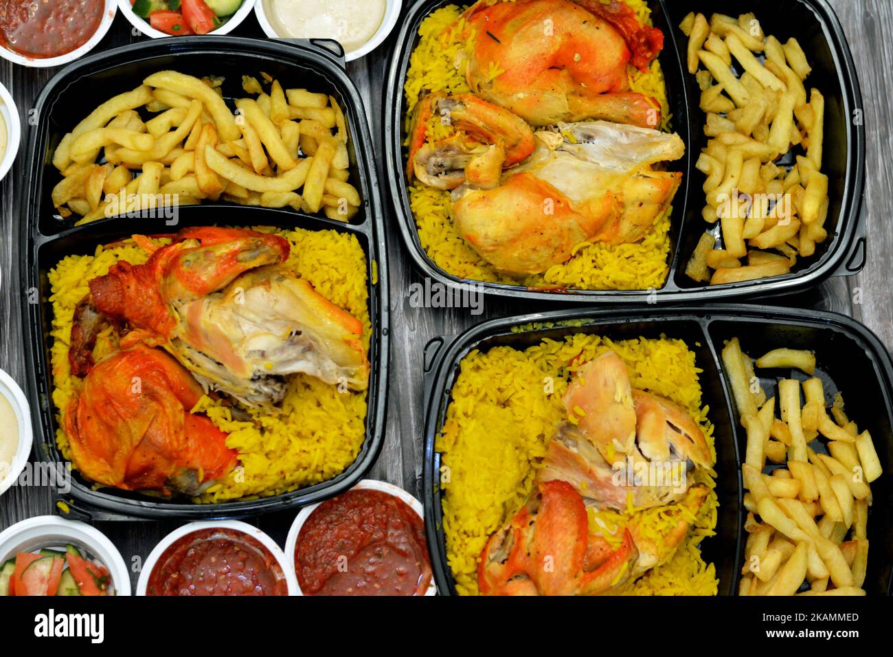 Chicken mandi kabsa with long basmati rice and french fries, served