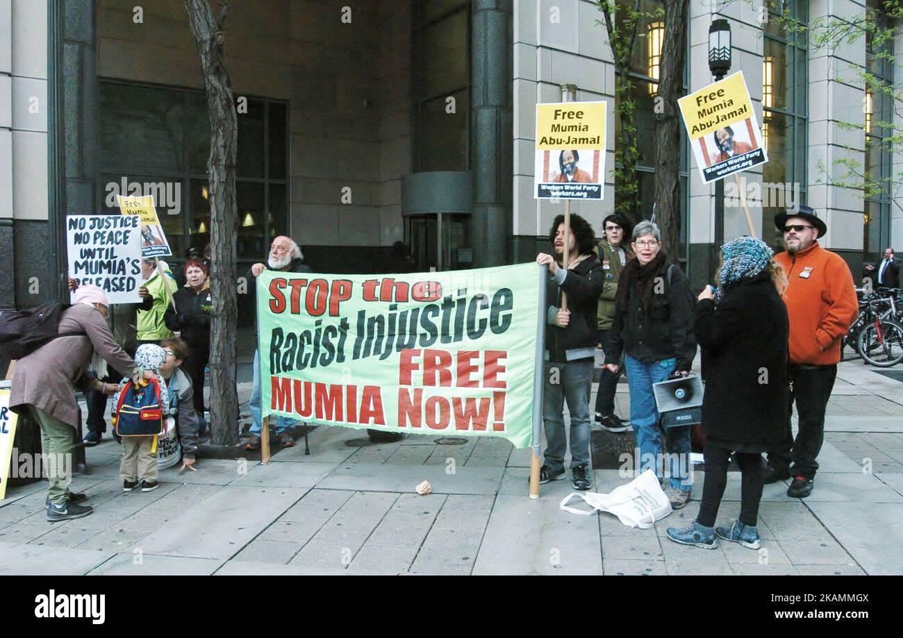 Supporters of Mumia Abu-Jamal rally outside the west entrance to the Criminal Justice Center in Philadelphia, PA on April 24, 2017. Mumia was convicted in 1981 of the murder of police officer Daniel Faulkner. His supporters around the world hold firm that the conviction was wrongful and that the prosecution both fabricated evidence and withheld exculpatory evidence in the case against Mumia. (Photo by Cory Clark/NurPhoto) *** Please Use Credit from Credit Field *** Stock Photo