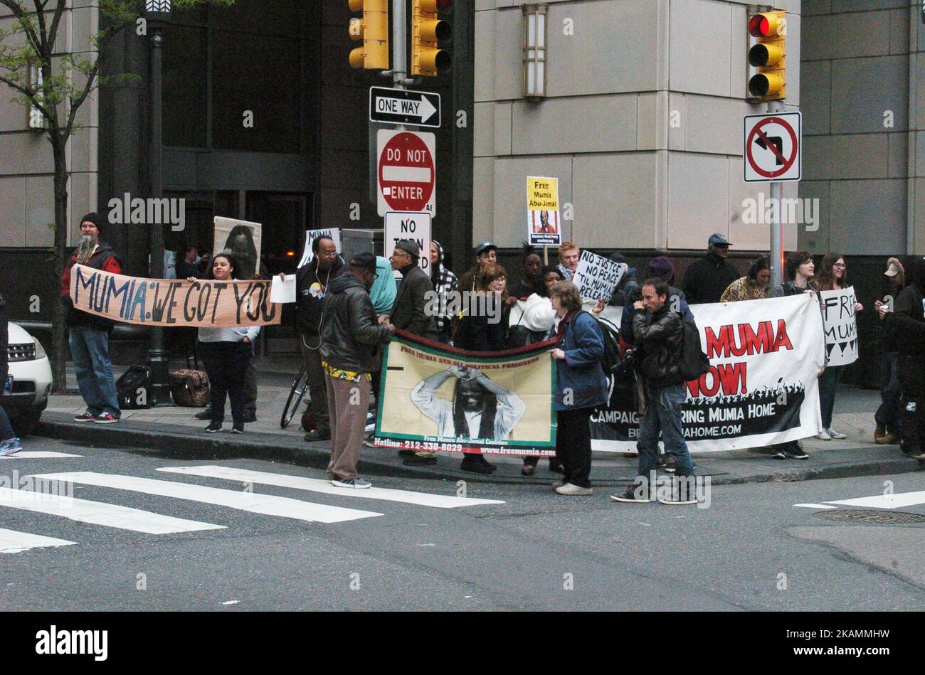 Supporters of Mumia Abu-Jamal rally outside the east entrance to the Criminal Justice Center in Philadelphia, PA on April 24, 2017. Mumia was convicted in 1981 of the murder of police officer Daniel Faulkner. His supporters around the world hold firm that the conviction was wrongful and that the prosecution both fabricated evidence and withheld exculpatory evidence in the case against Mumia. (Photo by Cory Clark/NurPhoto) *** Please Use Credit from Credit Field *** Stock Photo