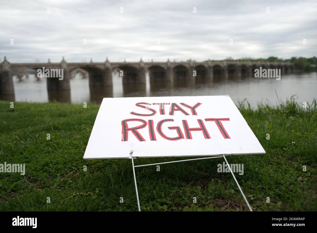 Sign that reads 'Stay Right' lays next to the Capital Area Greenbelt trail the Susquehanna River banks, in Harrisburg, PA, on the morning of April 30, 2017. Diminishing retail, crumbling infrastructure, environmental issues, poverty and unemployment are shown in a view on the current state of a section of rural America on day 101 of Trump's Presidency. The Keystone state Pennsylvania formed an important factor in Trump's victory in the 2016 US elections. (Photo by Bastiaan Slabbers/NurPhoto) *** Please Use Credit from Credit Field *** Stock Photo
