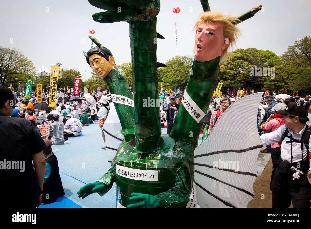A demonstrator wearing a costume with a dragon head, Shinzo Abe and Donald Trump effigies joins thousands of labor union demonstrators during the May Day Rally at Yoyogi Park on May 1, 2017 in Tokyo, Japan. (Photo by Richard Atrero de Guzman/NurPhoto) *** Please Use Credit from Credit Field *** Stock Photo