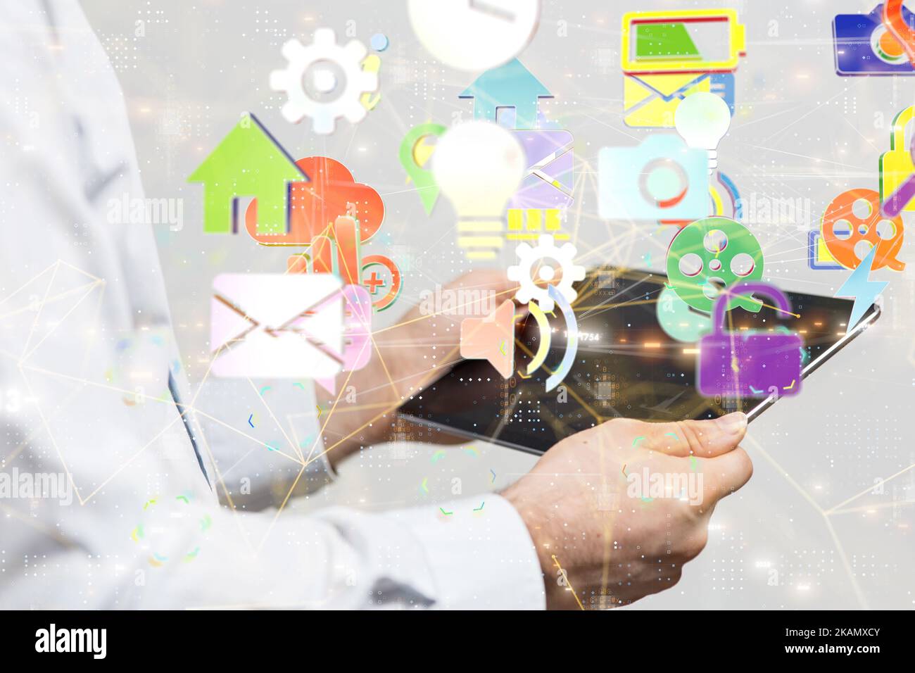 A 3D rendering of application icons floating above a tablet Stock Photo ...