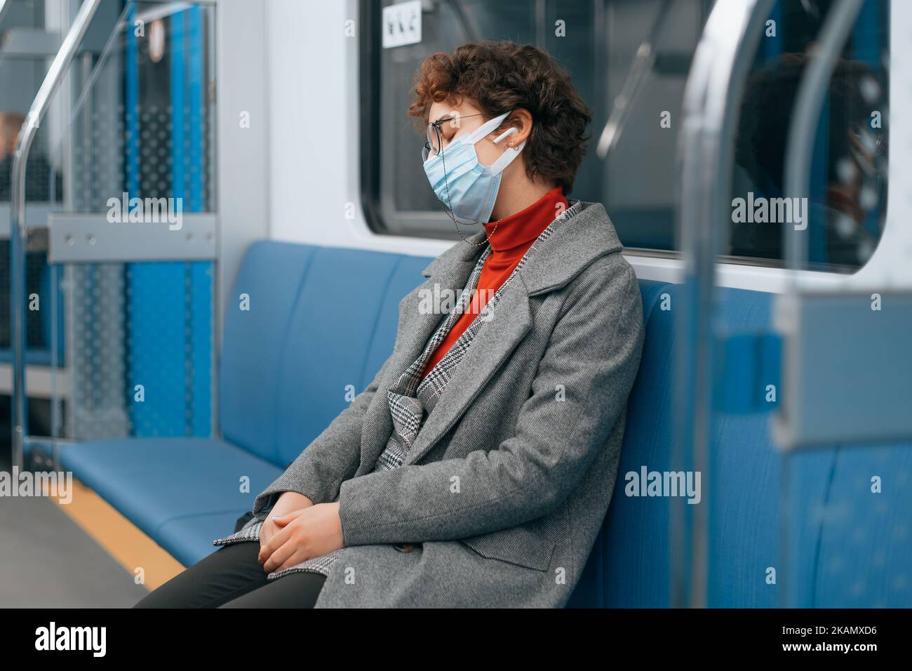 Woman in mask sleeping subway hi-res stock photography and images - Alamy