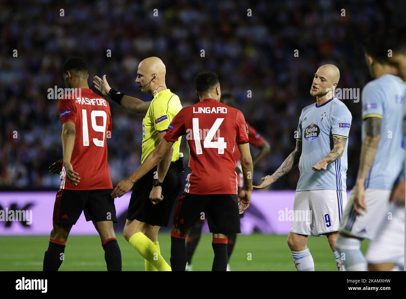 Players of Manchester United talks with John Guidetti forward of Celta de Vigo (9) during the UEFA Europe League Round of 2 first leg match between Celta de Vigo and Manchester United at Balaidos Stadium on May 4, 2017 in Vigo, Spain. (Photo by Jose Manuel Alvarez Rey/NurPhoto) *** Please Use Credit from Credit Field *** Stock Photo