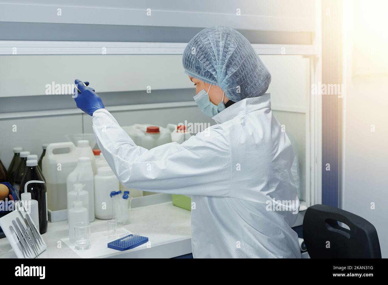 Scientist or laboratory assistant holding a test tube in a scientific medical laboratory. Biochemical research and medicine Stock Photo