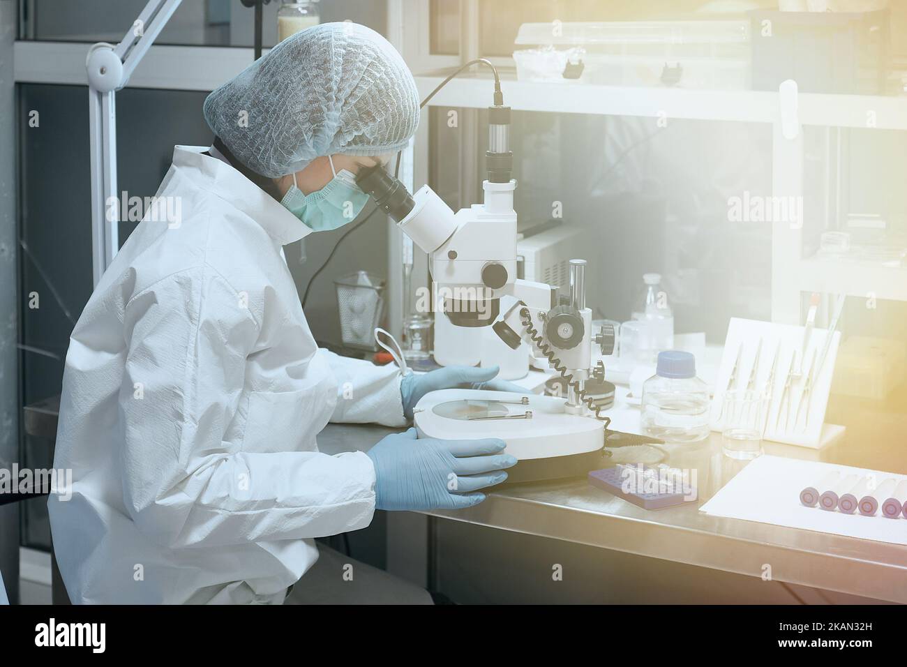 Scientist or nurse with Microscope in a Medical Science Laboratory Stock Photo