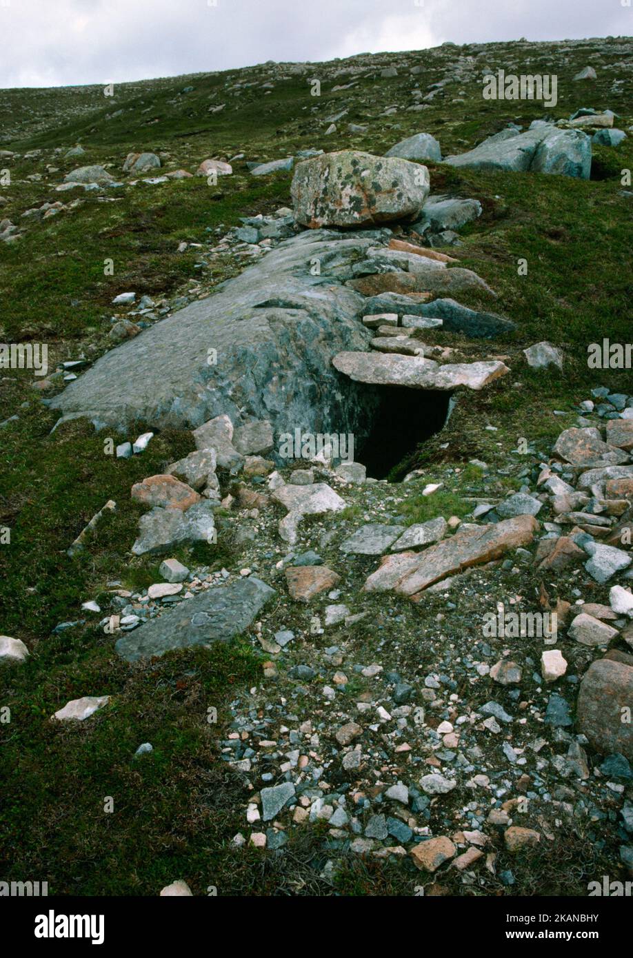 A large outcrop of felsite at Beorgs of Uyea, Shetland, Scotland, UK, was quarried, roofed over & used to produce Neolithic polished knives & axes. Stock Photo