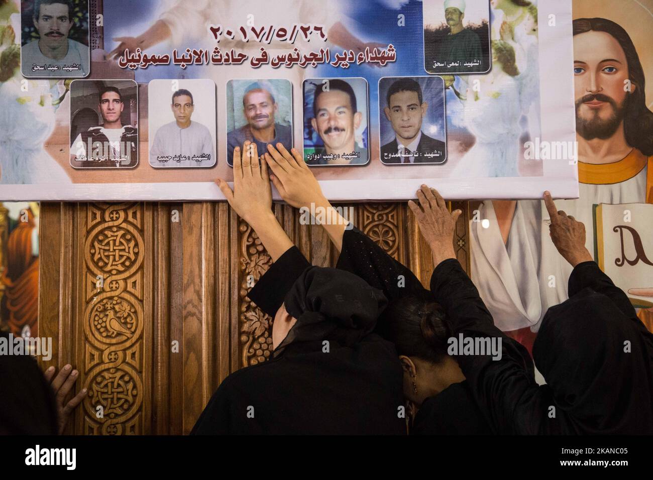 Prayers in 'Deir El-Garnouse Coptic church , near Al-Minya for the victims of of a terrorist attack. The prayers used to made in the homes of each victims families ritually at the third day of their death but Ava Aghathon the Bishop of the church insisted to make it for all the victims families tigether in the church. Christians died when fighters of the terror militia group Islamic State, or Daesh opened fire on their bus. (Photo by Ibrahim Ezzat/NurPhoto) *** Please Use Credit from Credit Field *** Stock Photo