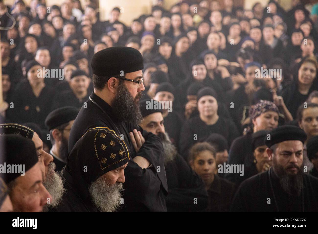 Prayers in 'Deir El-Garnouse Coptic church , near Al-Minya for the victims of of a terrorist attack. The prayers used to made in the homes of each victims families ritually at the third day of their death but Ava Aghathon the Bishop of the church insisted to make it for all the victims families tigether in the church. Christians died when fighters of the terror militia group Islamic State, or Daesh opened fire on their bus. (Photo by Ibrahim Ezzat/NurPhoto) *** Please Use Credit from Credit Field *** Stock Photo