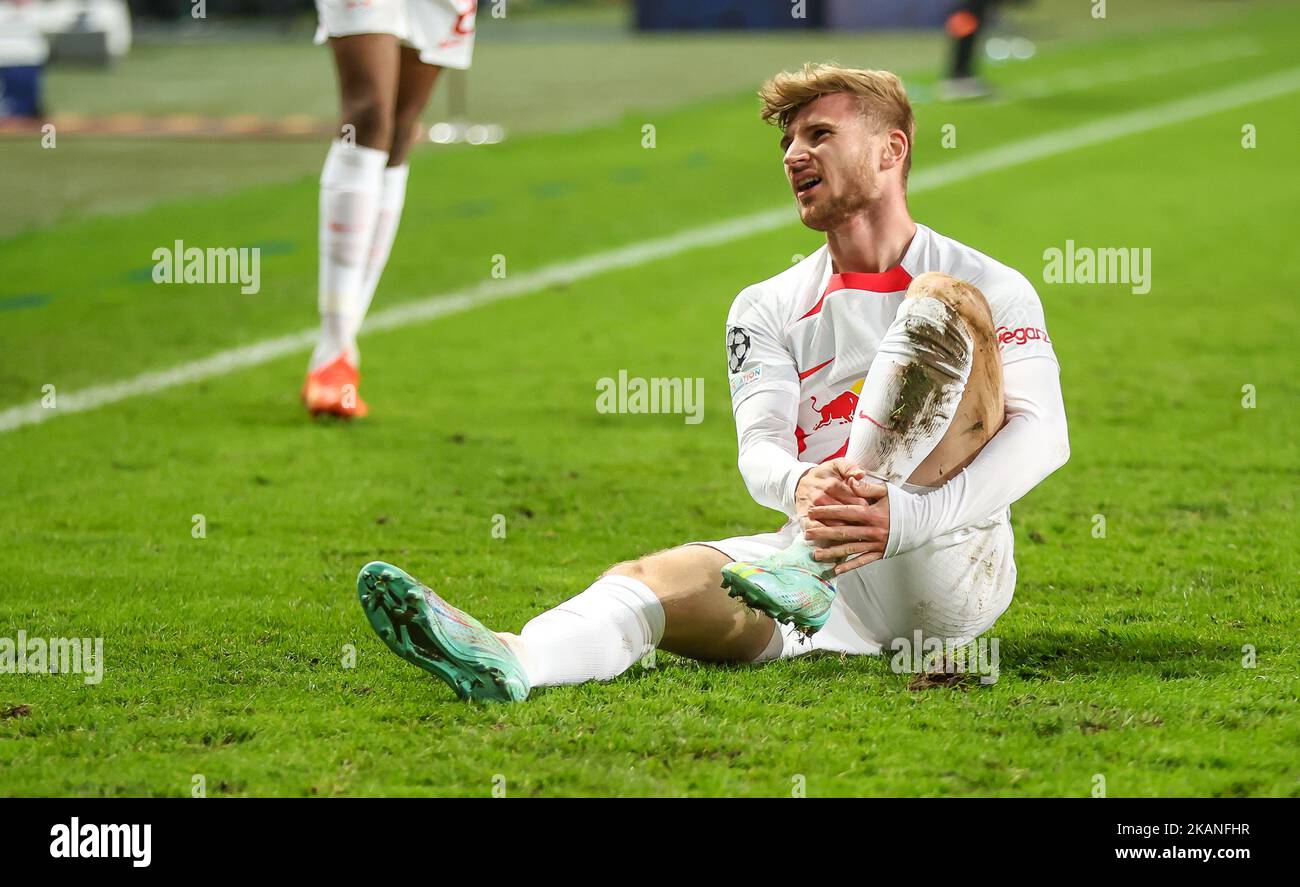 02 November 2022, Poland, Warschau: Soccer: Champions League, Group stage, Group F, Matchday 6 Shakhtyor Donetsk - RB Leipzig at Wojska Polskiego Stadion. Leipzig's player Timo Werner holds his ankle after a foul. Photo: Jan Woitas/dpa Stock Photo